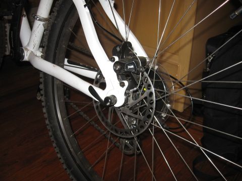 1992 Ford Ranger - Close-up of a bicycle's rear wheel assembly, showing the disc brake mechanism.