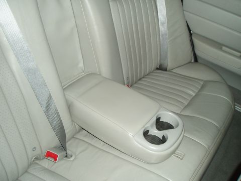 2003 Ford Crown Victoria - Interior view of the rear seat and armrest in a 2003 Ford Crown Victoria.