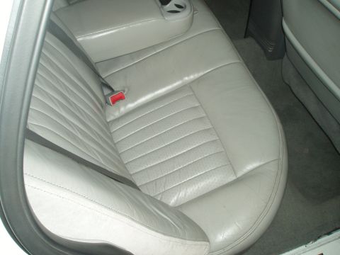 2003 Ford Crown Victoria - Interior view of a gray leather rear car seat with a seatbelt.