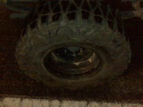 1979 Ford Bronco - A close-up view of a vehicle's tire and wheel, showing its tread pattern and rim.