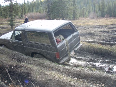1985 Ford Bronco - This 1985 Ford Bronco is stuck deep in the mud off-road.