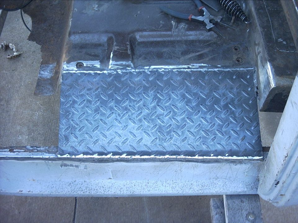 10-31-08:   I went over the weld beads quick with the grinder to clean them up a little. I'm going to smooth them out a little more once all the floors are in.
