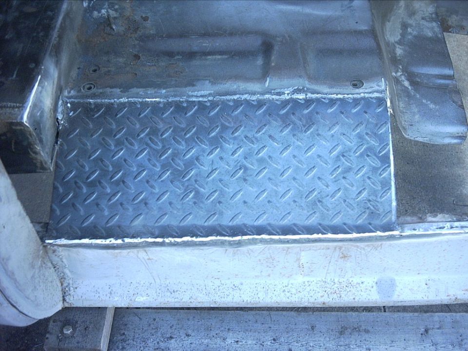 10-31-08:   I cleaned up the welds a little.

It's starting to come together. I'm hoping to get a big chunk of the floors done tomorrow.