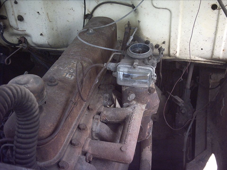 Dirty inline engine with glass-bowl fuel filter in engine bay