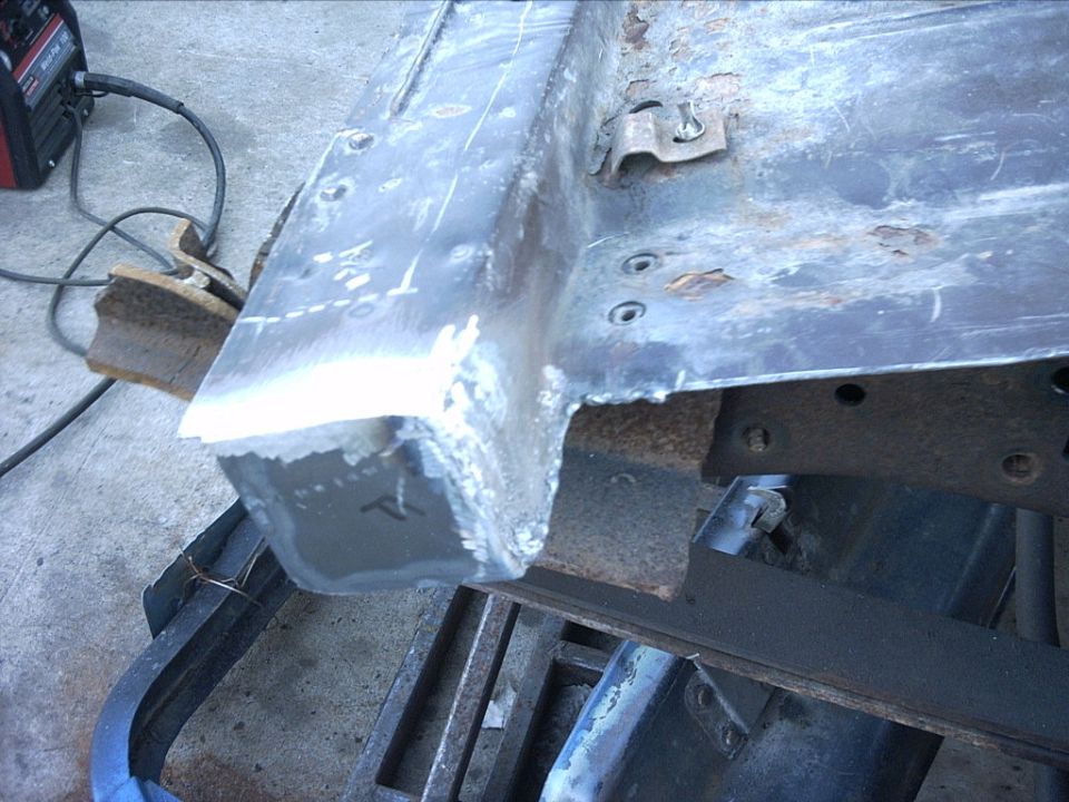 Frame rail end with fresh weld beads and grinder marks