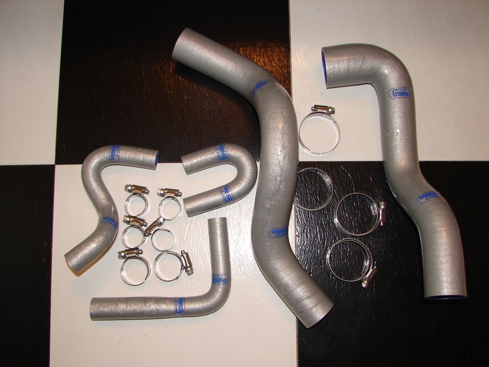 Set of silver silicone radiator hoses with blue markings and hose clamps