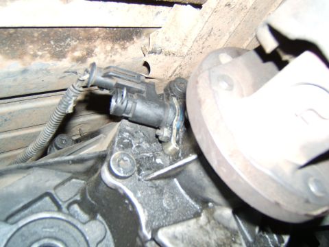 1988 Ford Bronco - Close-up view of a transmission speed sensor, a critical component for vehicle operation.