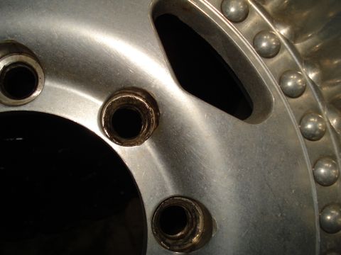 1967 Ford F-250 - Detail of a wheel hub, showing lug nut holes and decorative studs on the outer edge.