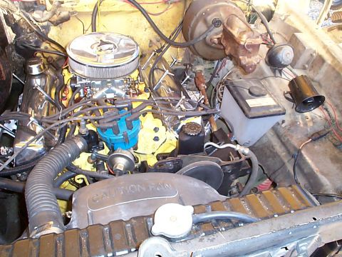 1978 Ford Bronco - Engine bay details including carburetor, distributor, and radiator. 'CAUTION FAN' text is visible.
