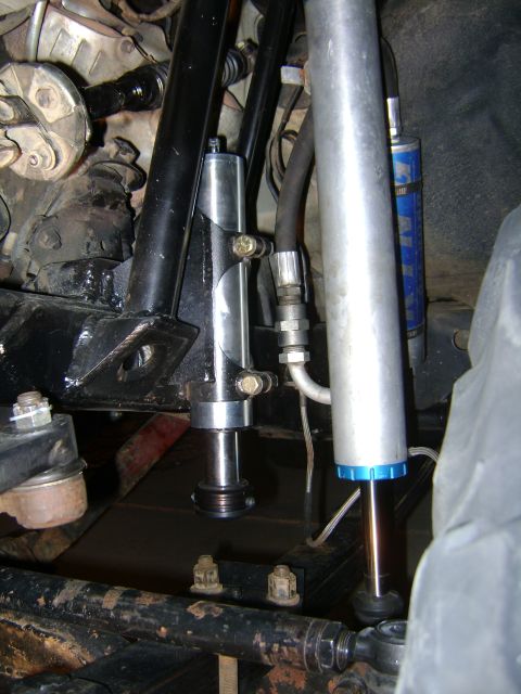 1993 Toyota 4Runner - Close-up view of off-road suspension components, including shocks and air bumps, on a vehicle.