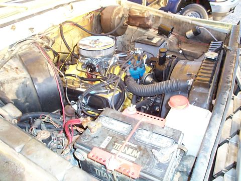 1978 Ford Bronco - Close-up view of a vehicle's engine bay, showing various components and wiring.