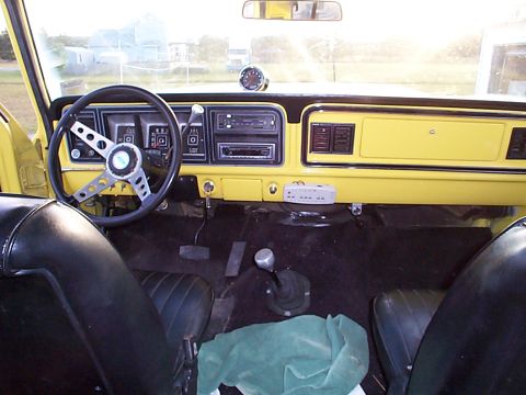 1978 Ford Bronco - Interior view of a 1978 Ford Bronco, showing the dashboard, steering wheel, and seats.