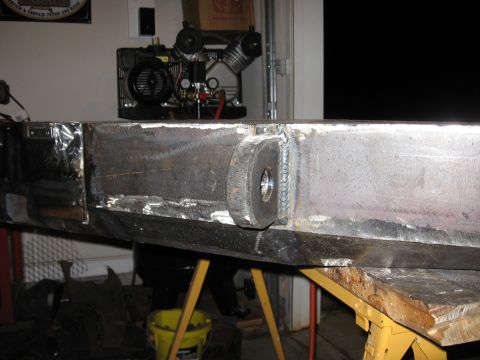 1995 Ford F-150 - A heavy-duty, custom-fabricated metal bumper is shown in a workshop setting, mounted on sawhorses.