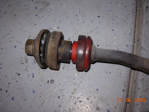 1991 Ford Taurus - Close-up of a sway bar end link showing its bushings.