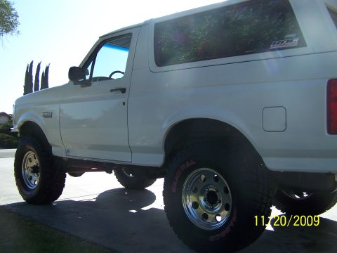 1995 Ford Bronco - This lifted 1995 Ford Bronco features off-road tires and a distinctive body style.
