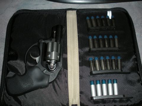 1996 Ford Bronco - Revolver and ammunition are neatly organized in a black carrying case.