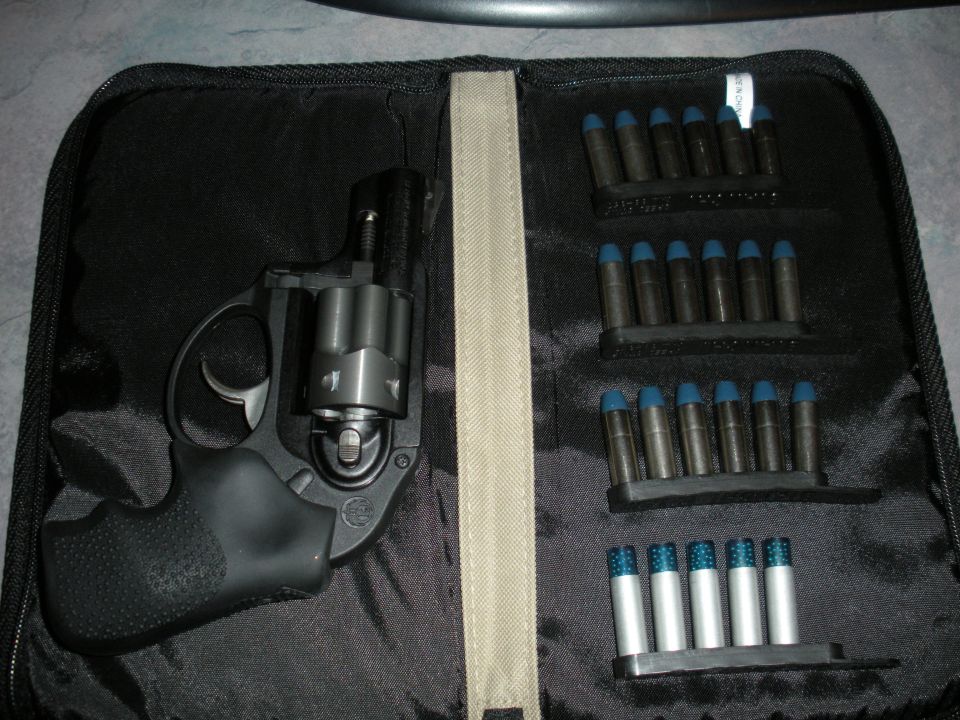 Revolver and speed loaders with ammunition in a black case