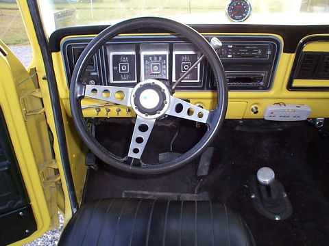 1978 Ford Bronco - Interior view of a 1978 Ford Bronco, the dashboard, steering wheel, and shifter.