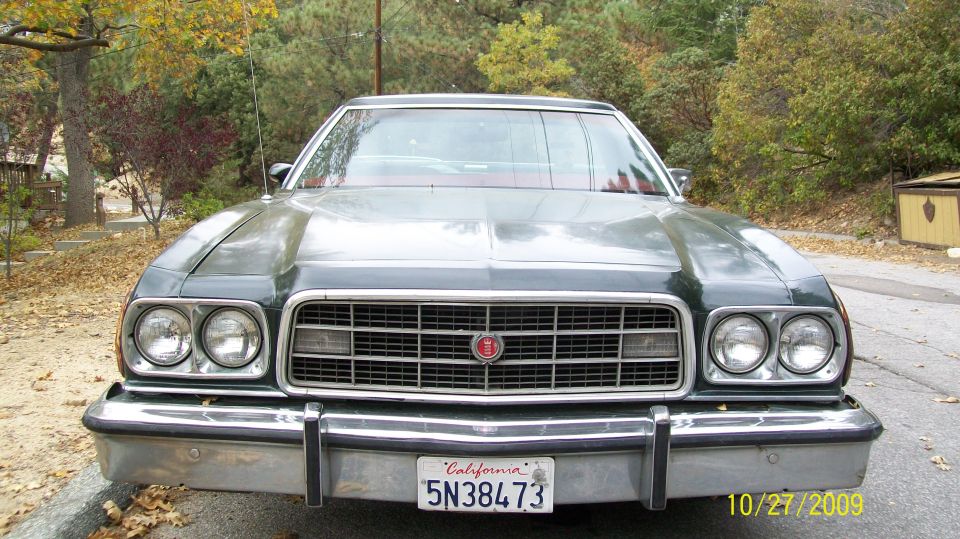 1973 Ford Ranchero front view, dark green exterior, chrome grille and bumper