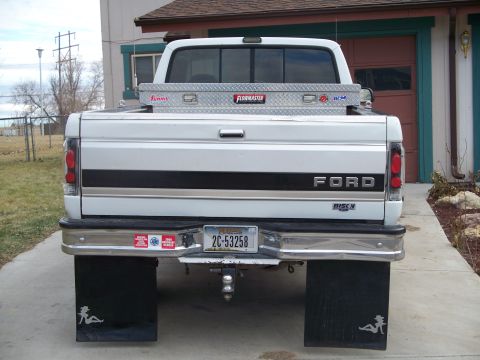 1992 Ford F-250 - Rear view of a 1992 Ford F-250 pickup truck, a toolbox and large mud flaps.