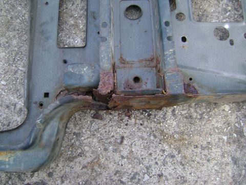 1994 Ford Bronco - A heavily rusted section of a vehicle frame is shown, indicating significant wear and tear.