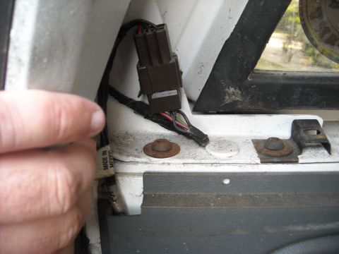 1994 Ford Bronco - A close-up view shows an electrical connector and wiring harness, with visible 'Made in Mexico' text on a label.
