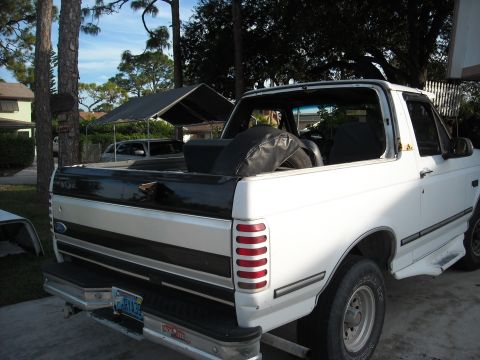 1994 Ford Bronco - This 1994 Ford Bronco is seen from the rear, with its top removed and a spare tire stored in the cargo bed.