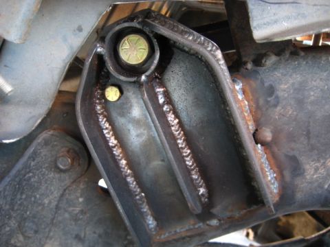 1989 Ford Bronco - This photo shows a custom bracket welded onto a vehicle's frame, indicating modifications or repairs.