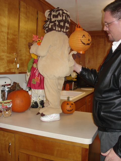 2000 Ford Crown Victoria - Halloween decorations and costumes are set up on a kitchen counter.