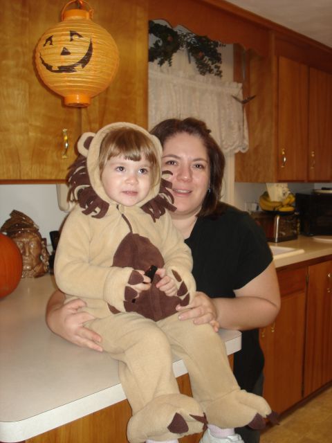 2000 Ford Crown Victoria - Woman and child in lion costume in kitchen with Halloween decorations.