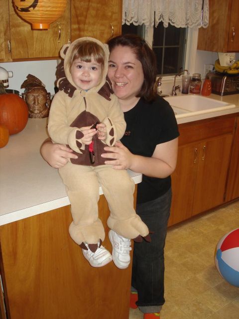 2000 Ford Crown Victoria - Woman and child in lion costume pose in a kitchen during Halloween.