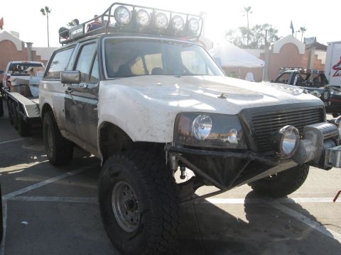 1986 Ford Bronco - Modified Bronco with off-road modifications, seen at an event.