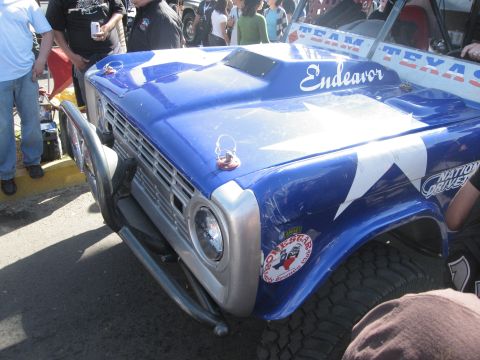 1986 Ford Bronco - Customized Ford Bronco with 'Endeavor' text on the hood scoop and Texas star graphics.