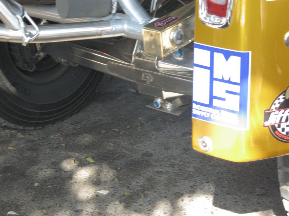 Gold SUV rear quarter panel with "IMS INDUSTRIAL SUPPLY CO." decal and "Jiffy" logo sticker