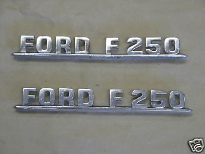 1954 Ford F-100 - I picked up this pair of 53/54 F250 emblems off Ebay for $15.00. These need a little work. But these aren't the easiest emblems to find.