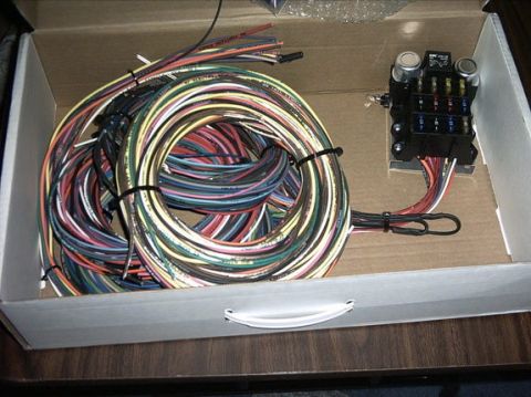 1954 Ford F-100 - A new wiring harness and fuse box kit is shown inside its packaging.
