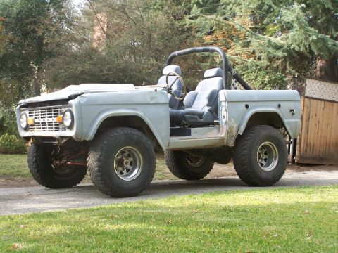 1973 Ford Bronco - This classic Ford Bronco is missing its doors and hood, showing its interior and engine bay.