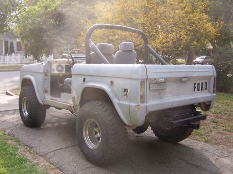 1973 Ford Bronco - This 1973 Ford Bronco is shown in a rear 3/4 view, a roll cage and a light blue primer finish.