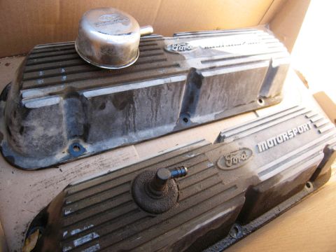 1986 Ford Bronco - A pair of used cast-aluminum Ford Motorsport finned valve covers sitting in a cardboard box, one fitted with a chrome Ford Racing push-in b…