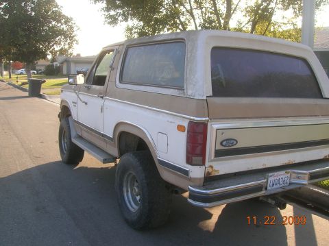1985 Ford Bronco - This Ford Bronco has a two-tone paint scheme and appears to be from the early 1980s.