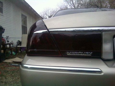 2000 Mercury Grand Marquis - Rear view of a Mercury Grand Marquis, tinted taillights and chrome trim.
