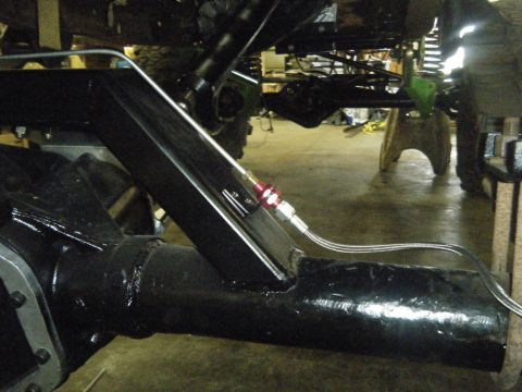 1978 Ford Bronco - Close-up view of vehicle frame and suspension parts, with "SUPERMOTORS.NET" visible at the bottom right.