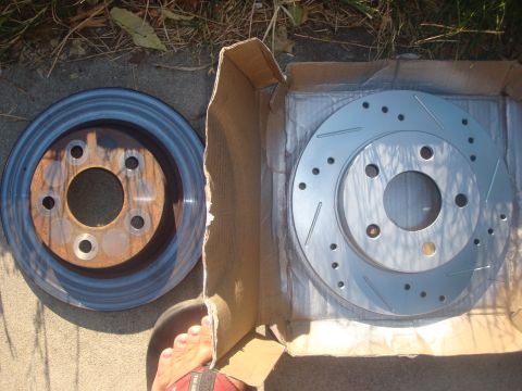1995 Ford Taurus - Comparing a used brake rotor to a new slotted and drilled rotor.