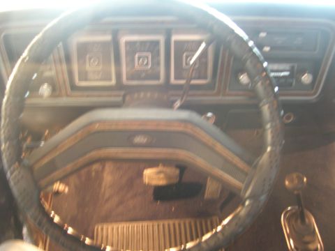1975 Ford F-250 - Interior view of a 1975 Ford F-250, highlighting the dashboard and steering wheel.