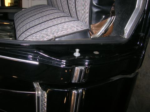 1975 Ford F-250 - Close-up view of a vehicle's interior, focusing on the seat and door frame details.