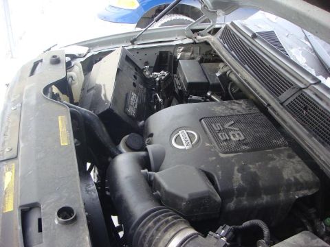 2008 Nissan Titan - The engine compartment of a Nissan Titan is visible, the 5.6L V8 engine.