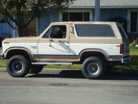 1986 Ford Bronco - This Ford Bronco has a two-tone paint scheme with brown accents and a removable hardtop.