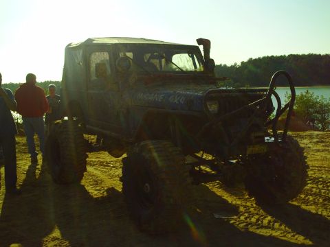 1990 Ford Bronco - This heavily modified Jeep is ready for off-road adventures, with its tall tires and snorkel system.