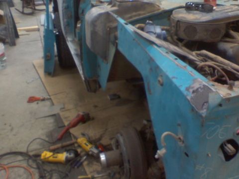 1972 Ford Bronco - This vehicle is in a state of disrepair, with various tools scattered around it.