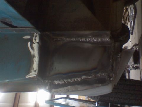 1972 Ford Bronco - Close-up view of fresh welds on a vehicle's frame, indicating body work or repair.